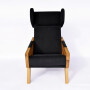 Wygodny, duży, komfortowy, minimalistyczny fotel uszak. Czarny fotel do salonu, pomarańczowy fotel, czerwony fotel, zielony fotel.