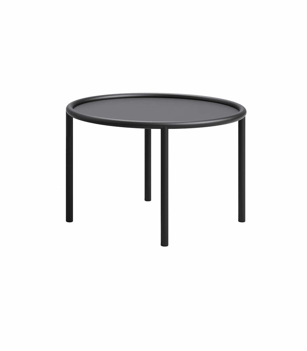 Okrągły, minimalistyczny stolik kawowy o bardzo prostej formie. Rama mebla, nogi i blat płynnie się przenikają.