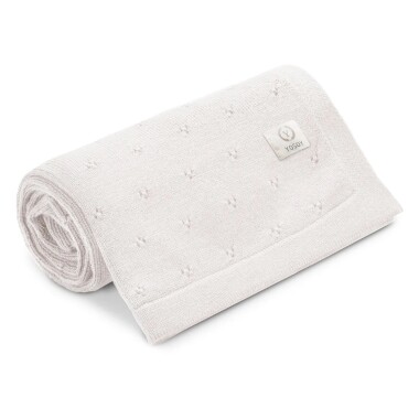 Kremowy kocyk z wełny merono o delikatnym splocie