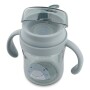 Przezroczysty szary kubek z tritanu dla niemowląt Trixie z higieniczną przykrywką. Rekin